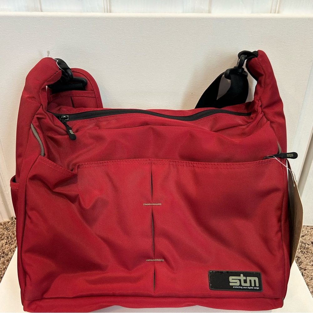 STM small phantom shoulder laptop bag red in color